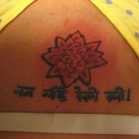 Lotus flower with hindu writings tattoo