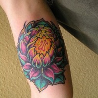 Detailed lotus flower tattoo on arm