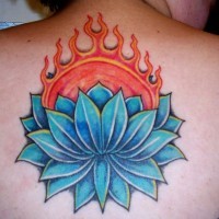 Blue lotus with sun in it tattoo on back