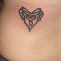 Heart symbol tracery tattoo