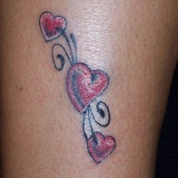 Red hearts tracery tattoo