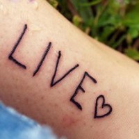 Live and heart symbol tattoo