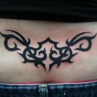 Lower back tattoo, black, bright, rounded pattern