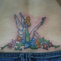 Lower back tattoo, charming , slim fairy sitting on flowers