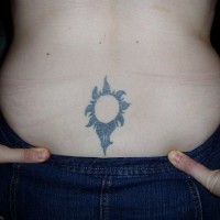 Lower back tattoo, designed flower like a sun-flower