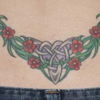 Lower back tattoo, chains decorated with plant , flowers