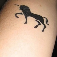 Small black unicorn tattoo