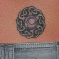 Lower back knotted gem tattoo