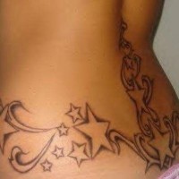 Lower back tattoo, many designed  stars