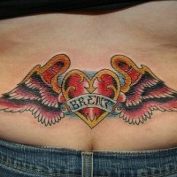 Lower back tattoo, loveheart brent, decorated with parti-coloured wings