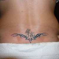 Lower back tattoo, butterfly on hieroglyph, styled