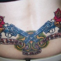 Lower back tattoo, two blue, crossed guns, flowers