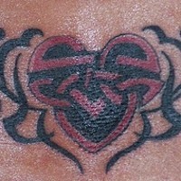 Lower back tattoo, modified black and red heart