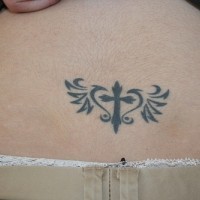 Lower back tattoo, cross decotated in heart