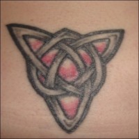 Lower back tattoo, triangle of chains