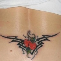 Lower back tattoo, two red cherries in black styled pattern