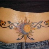 Lower back tattoo, sun and moon, yellow and black image
