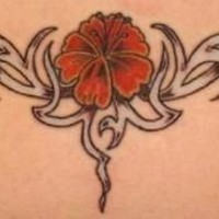Lower back tattoo, nice red flower in black styled pattern
