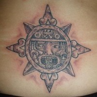 Lower back tattoo, sun-face, teethy, designed object