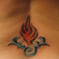 Lower back tattoo, styled little fire in water