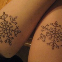 Matching friendship tattoos of snowflake