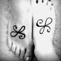 Matching friendship symbol tattoos