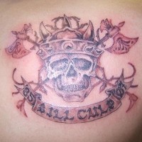 Barbarian skull with weapons tattoo