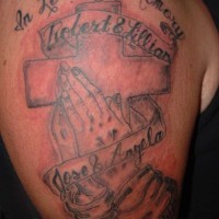 Prayer hands and cross with writings tattoo