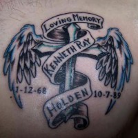 Winged latin cross in memory of Kenny tattoo