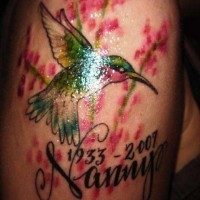 Colourful hummingbird memorial tattoo