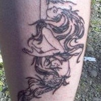 Elegant mermaid black ink tattoo