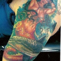 Realistic mermaid and dolphin detailed tattoo