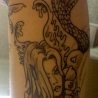 Mermaid face black ink tattoo