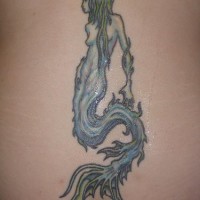 Green haired mermaid tattoo on lower back