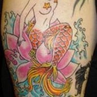 Mermaid on water lily tattoo in colour