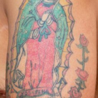 Mexican saint image with roses tattoo