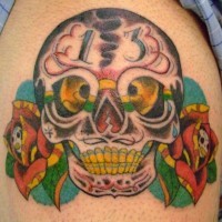 Evil sugar skull with roses tattoo