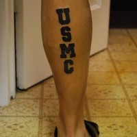 Usmc writing tattoo on leg