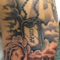 Dog tag in clouds memorial tattoo