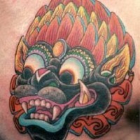 Colourful asian demon in feathers tattoo