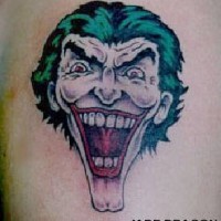 Classic laughing joker with green hair tattoo