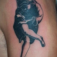 Girl cutting up own leg tattoo
