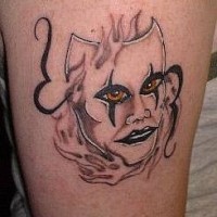 Creepy mask with real eyes and lips tattoo