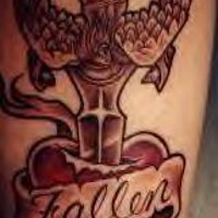 Heart stubbed with winged knife tattoo