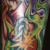 Flaming explosion cartridge tattoo in colour