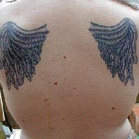 Macaroni wings tattoo on back
