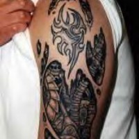 Tribal biomech skin rip tattoo