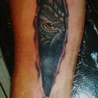 Monster ripping through skin tattoo