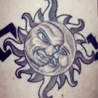 Black ink sun and moon tattoo