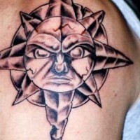 Stone sun symbol tattoo